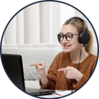 student-online-cute-girl-glasses-sweater-studying-computer-smiling